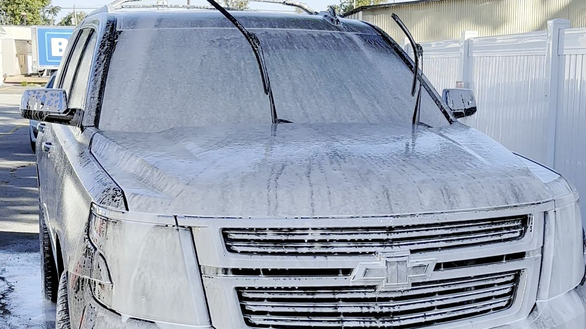 Chevy SUV covered in thick snow foam during a ShineLab wash