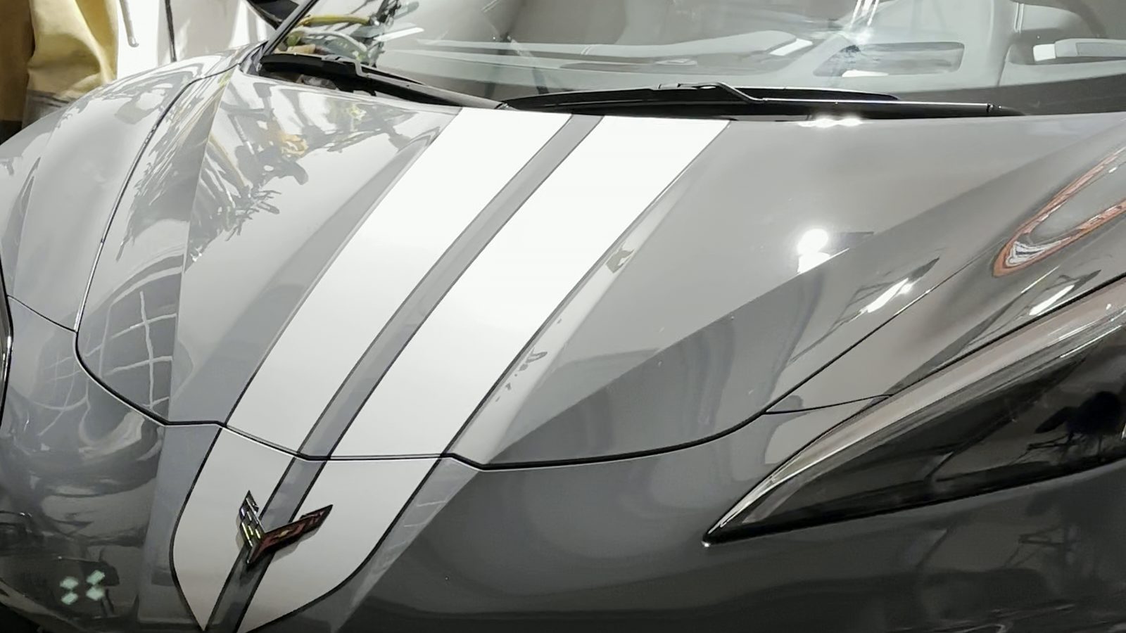 Glossy gray C8 Corvette with white stripes after a ShineLab detail